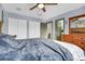 Primary bedroom with large closet, ceiling fan, and adjacent bathroom at 5284 Willow Ct, Castle Rock, CO 80104