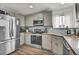 Modern kitchen featuring stainless steel appliances and light wood cabinets at 5284 Willow Ct, Castle Rock, CO 80104