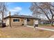 Charming ranch-style home with a well-maintained lawn and inviting front entrance at 1841 S Forest St, Denver, CO 80222