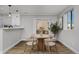 Cozy dining room featuring modern table and chairs, complemented by natural light, perfect for intimate meals at 2187 S Fox St, Denver, CO 80223