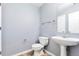 Powder bathroom featuring a pedestal sink and tile floors at 11069 York St, Northglenn, CO 80233
