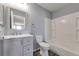 Bathroom featuring vanity, toilet, combination shower and tub, and light gray walls at 11069 York St, Northglenn, CO 80233