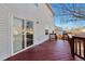 Home's outdoor deck features wood railings and sliding glass door at 11069 York St, Northglenn, CO 80233