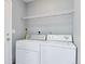 Laundry room equipped with white washer and dryer units at 11069 York St, Northglenn, CO 80233