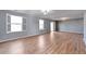 Bright living room with hardwood floors and shuttered windows at 11069 York St, Northglenn, CO 80233