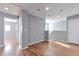 Spacious upstairs living space with hardwood floors, neutral paint, and lots of natural light at 11069 York St, Northglenn, CO 80233
