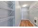 Walk-in closet with multiple rows of wire shelving and hardwood floors at 11069 York St, Northglenn, CO 80233