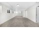 Spacious finished basement with neutral carpet, white walls, recessed lighting and bright windows at 5556 S Sedalia St, Centennial, CO 80015