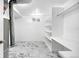 Unique basement with open shelving, storage, and modern patterned floors at 5556 S Sedalia St, Centennial, CO 80015
