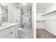 Modern bathroom showcasing elegant marble tile and access to walk-in closet at 5556 S Sedalia St, Centennial, CO 80015