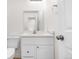 Bathroom with a toilet, a vanity and a doorway, and a mirror at 5556 S Sedalia St, Centennial, CO 80015