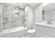 Stylist bathroom with modern fixtures, marble tile and a bathtub at 5556 S Sedalia St, Centennial, CO 80015