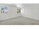 Bright bedroom featuring plush carpet, white walls, natural light, and a closet at 5556 S Sedalia St, Centennial, CO 80015