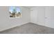 Inviting bedroom with new carpet and window, perfect for relaxation at 5556 S Sedalia St, Centennial, CO 80015