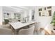 Dining room featuring a marble tabletop with upholstered chairs and hardwood floors at 5556 S Sedalia St, Centennial, CO 80015