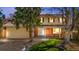 Charming home boasting a well-manicured lawn and a welcoming double-door entrance with brick accents at 5556 S Sedalia St, Centennial, CO 80015