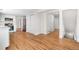 Kitchen featuring white cabinets, hardwood floors, and stainless steel appliances at 5556 S Sedalia St, Centennial, CO 80015