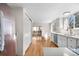 Modern kitchen with stainless steel appliances, white cabinets, and sliding door access at 5556 S Sedalia St, Centennial, CO 80015