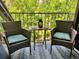 Relaxing balcony features comfortable wicker seating, patterned rug, and lovely views at 830 S Vance St # F, Lakewood, CO 80226