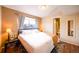 Comfortable bedroom with a large window, wood floors and a connected bathroom for easy access at 830 S Vance St # F, Lakewood, CO 80226