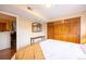 Bedroom featuring wood floors, and a large closet with sliding doors at 830 S Vance St # F, Lakewood, CO 80226