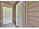 Well-maintained exterior entrance featuring secure doors and neutral siding at 830 S Vance St # F, Lakewood, CO 80226