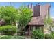 Attractive brick building with mature trees and well-maintained landscaping at 830 S Vance St # F, Lakewood, CO 80226