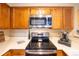 Close up of a well-equipped kitchen featuring stainless steel appliances, sleek countertops, and ample storage at 830 S Vance St # F, Lakewood, CO 80226