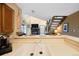 Bright kitchen featuring a countertop that offers an open view of the living room and fireplace at 830 S Vance St # F, Lakewood, CO 80226