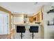 Modern kitchen featuring a breakfast bar with seating and stainless steel appliances and ample counter space at 830 S Vance St # F, Lakewood, CO 80226