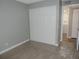 Bedroom features neutral walls, carpet flooring, and a closet with sliding doors at 9887 E Peakview Ave # F06, Englewood, CO 80111