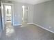 Spacious bedroom with neutral carpet and gray walls; includes bathroom and walk-in closet at 9887 E Peakview Ave # F06, Englewood, CO 80111