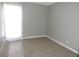 Bedroom featuring a bright window, neutral walls, and carpet flooring at 9887 E Peakview Ave # F06, Englewood, CO 80111