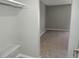 Walk-in closet with shelving, neutral walls, and carpet leading into bedroom at 9887 E Peakview Ave # F06, Englewood, CO 80111