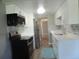 Recently remodeled kitchen with stainless steel appliances and white cabinets and marble backsplash at 9887 E Peakview Ave # F06, Englewood, CO 80111