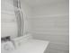 Functional laundry area featuring a washing machine, dryer, and ample shelving for storage at 9887 E Peakview Ave # F06, Englewood, CO 80111