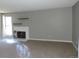 Cozy living room features a brick fireplace and floating shelves for added charm at 9887 E Peakview Ave # F06, Englewood, CO 80111