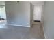 Spacious living room leading to a well-lit entrance foyer for easy access at 9887 E Peakview Ave # F06, Englewood, CO 80111