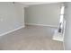Spacious living room features neutral walls, carpeting, and a cozy fireplace at 9887 E Peakview Ave # F06, Englewood, CO 80111