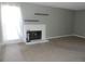 Inviting living room showcases a classic brick fireplace and window at 9887 E Peakview Ave # F06, Englewood, CO 80111