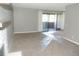 Open living space with access to the balcony through sliding glass doors at 9887 E Peakview Ave # F06, Englewood, CO 80111