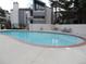 Community pool surrounded by greenery, offering a refreshing escape at 9887 E Peakview Ave # F06, Englewood, CO 80111