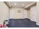 Finished basement with dark floors, neutral colored walls, recessed lighting, and white doors at 10935 Valleybrook Cir, Highlands Ranch, CO 80130