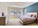 Spacious bedroom with a king-sized bed, dresser, and multiple windows providing ample natural light at 10935 Valleybrook Cir, Highlands Ranch, CO 80130