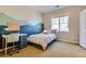 Bright bedroom features a mountain mural, desk, and plush carpeting at 10935 Valleybrook Cir, Highlands Ranch, CO 80130