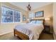 Comfortable bedroom with large windows, natural light, and stylish chandelier and decor at 10935 Valleybrook Cir, Highlands Ranch, CO 80130