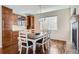 This dining area is designed with hardwood floors, cabinetry, and a cozy fireplace feature at 10935 Valleybrook Cir, Highlands Ranch, CO 80130