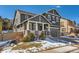 Charming two-story home with stone accents, covered porch, and attached two-car garage at 10935 Valleybrook Cir, Highlands Ranch, CO 80130
