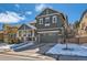 Charming two-story home with stone accents, covered porch, and attached two-car garage at 10935 Valleybrook Cir, Highlands Ranch, CO 80130