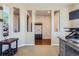 View of a home office featuring a small desk, TV and a coat rack through the hallway portals at 10935 Valleybrook Cir, Highlands Ranch, CO 80130